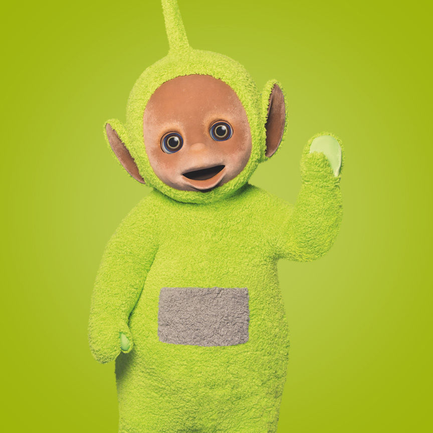 The green Teletubby Dipsy with a grey tummy and a pointy antenna waving