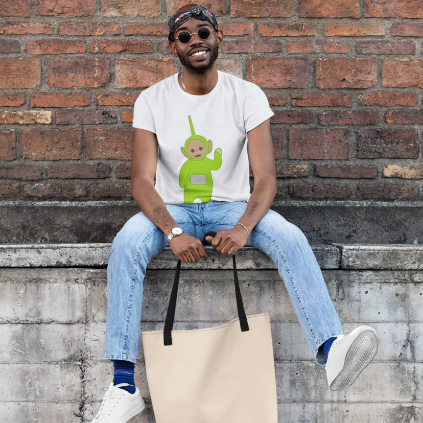 A model wearing a white t-shirt with the green Teletubby Dipsy on it