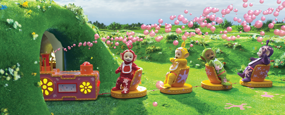 All four Teletubbies outside on the Tubby Custard Ride.