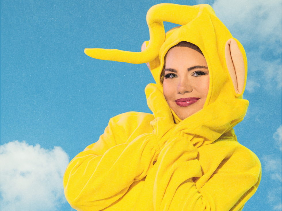 Models pose in Teletubby costumes against a blue background with white clouds.