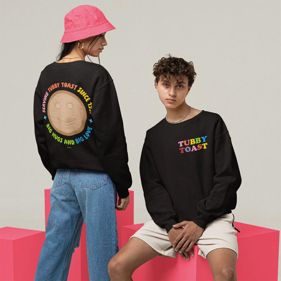 a model standing and a model sitting, both wearing black sweaters with "Tubby Toast" on them