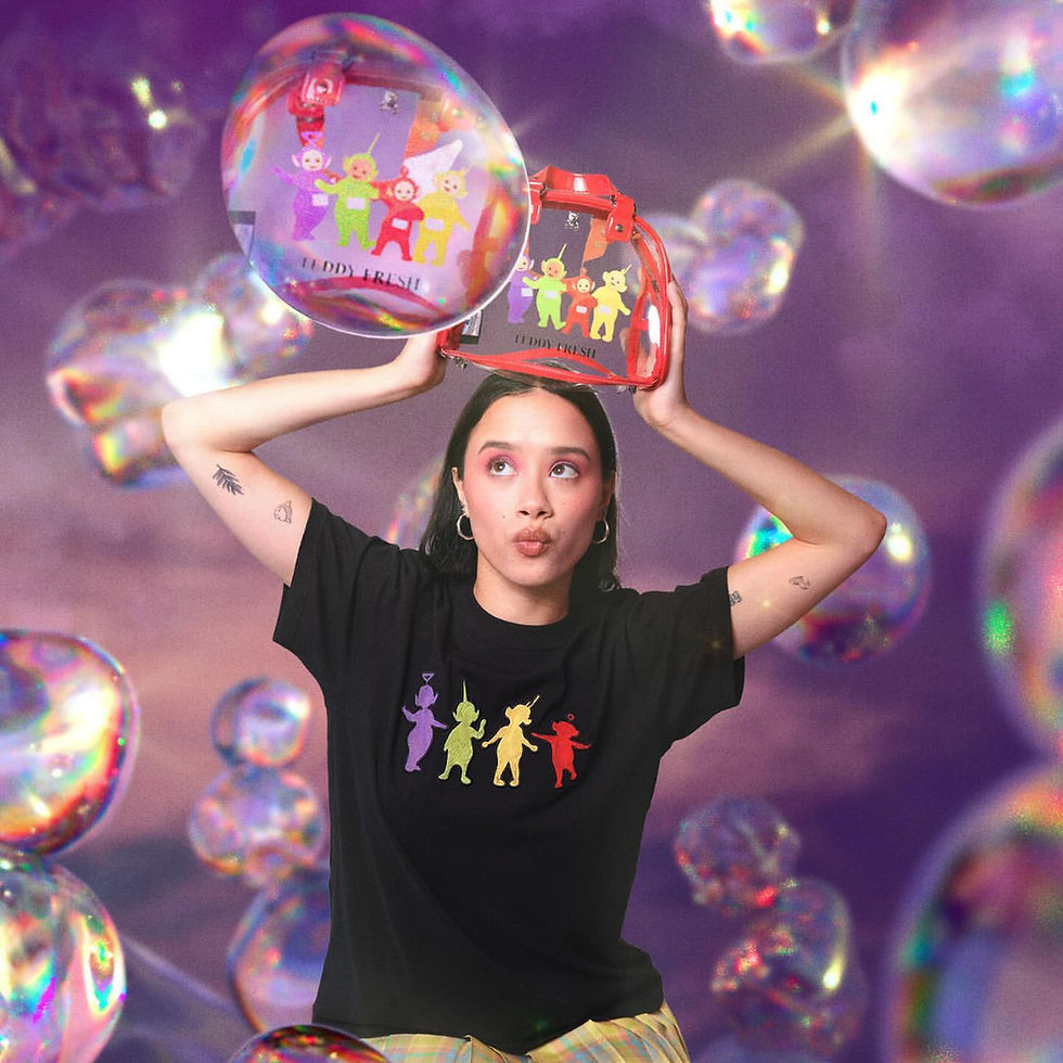 model holding a clear bag with four colourful characters on it above their head with bubbles all around