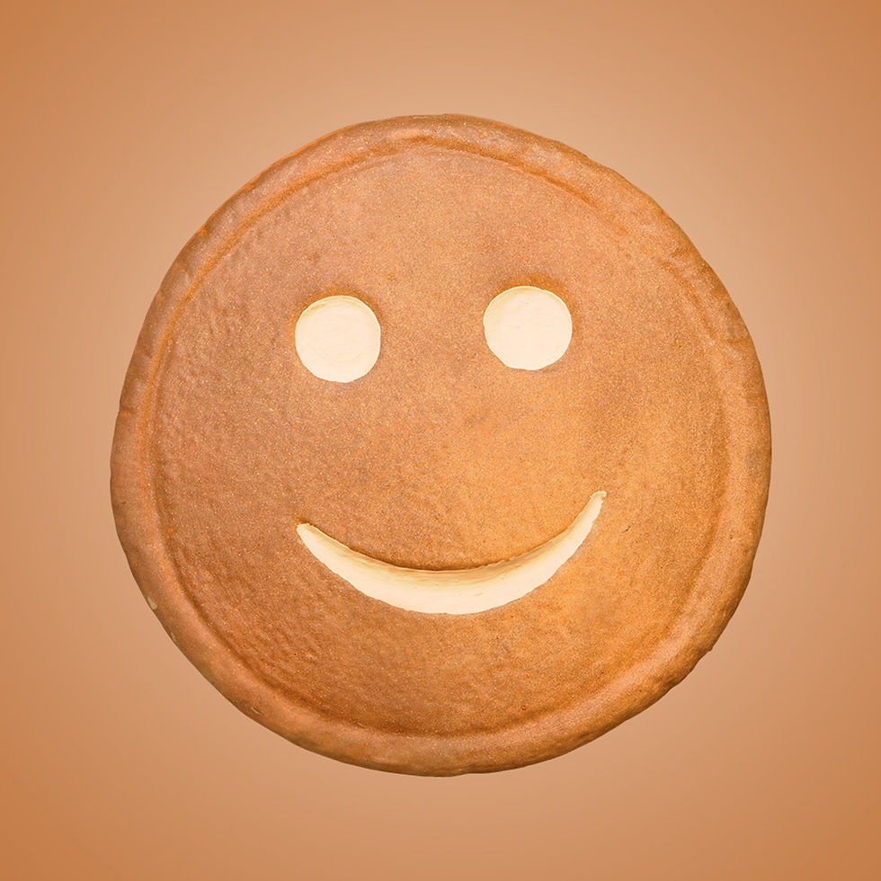 a round piece of tubby toast with a smiley face